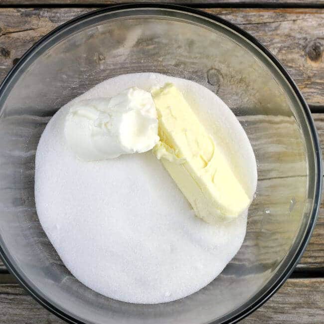 Butter, shortening, and sugar in a glass bowl.