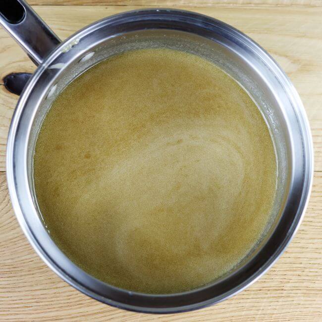 The butter, brown sugar, and cream are melted together in a saucepan.