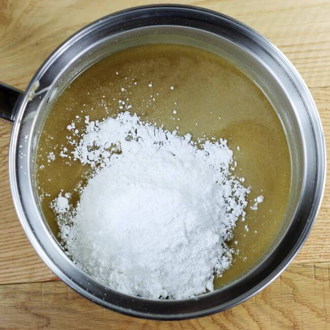 Powdered sugar is added to the melted brown sugar mixuture.