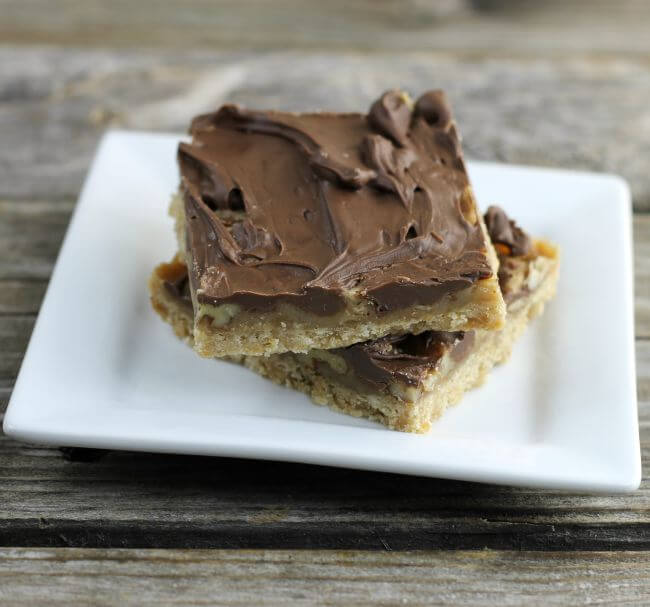 Turtle cookie bars on a white plate.