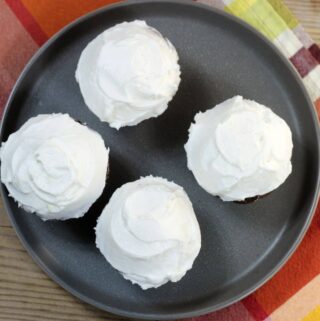Looking down at a plate of cupcakes.