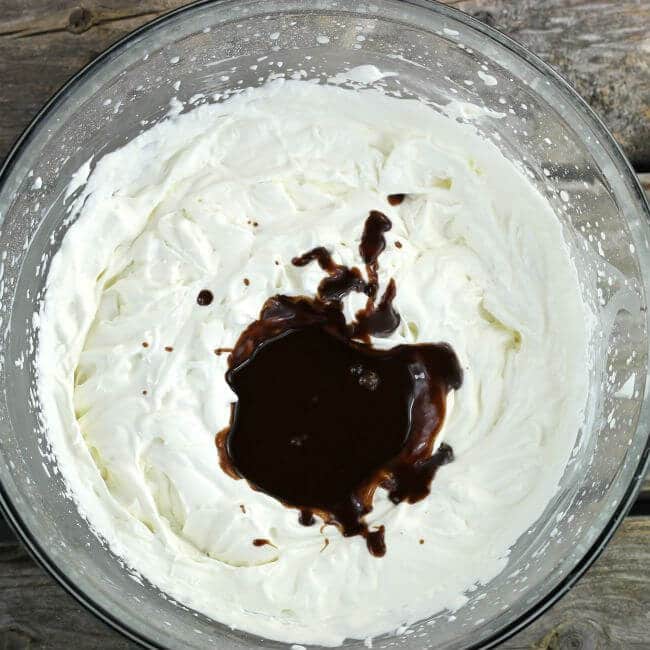 Melted chocolate add to whipped cream.