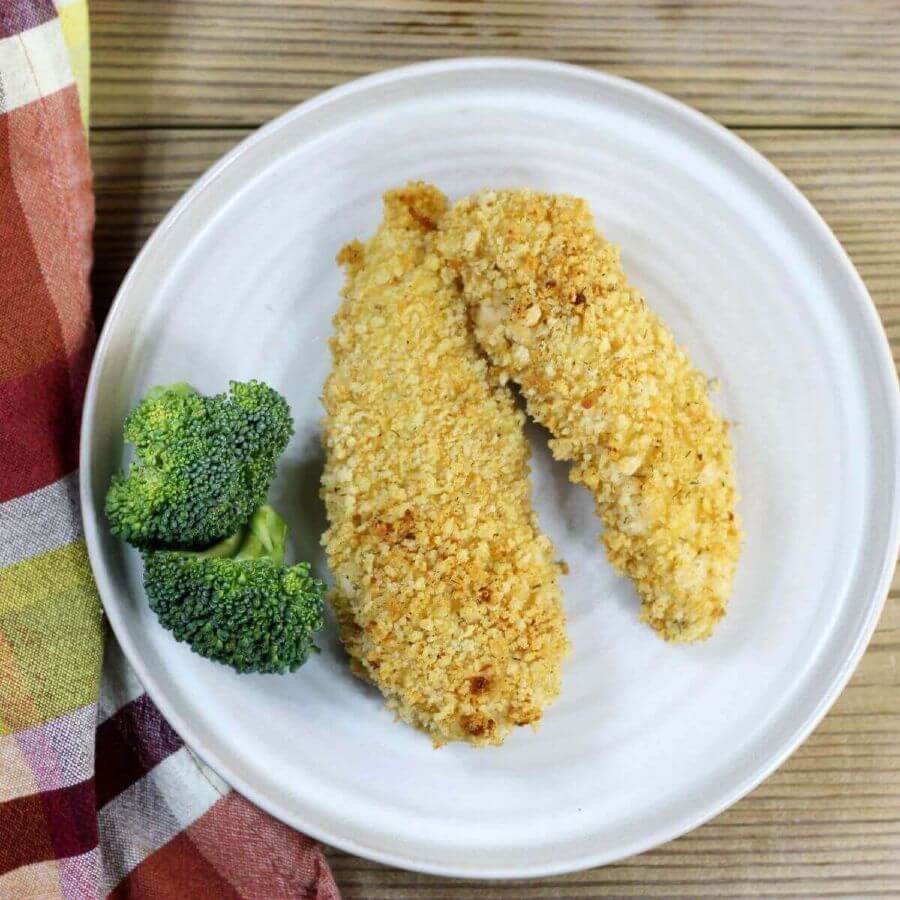 Overlooking a plate with breaded chicken tenders and broccoli.