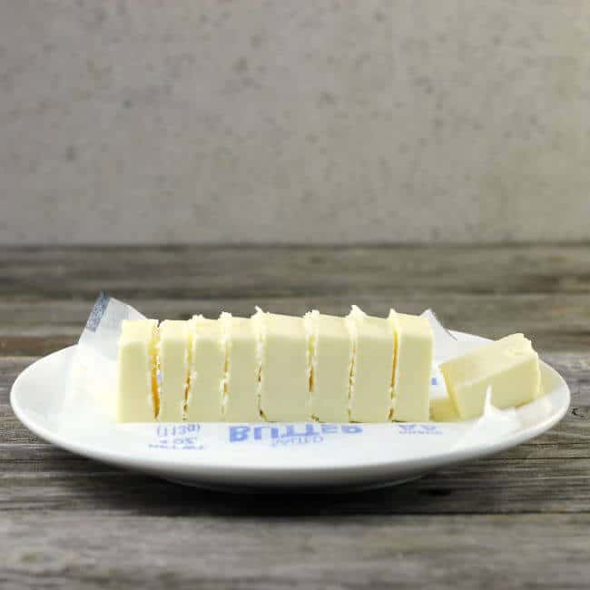 Butter on white plate.