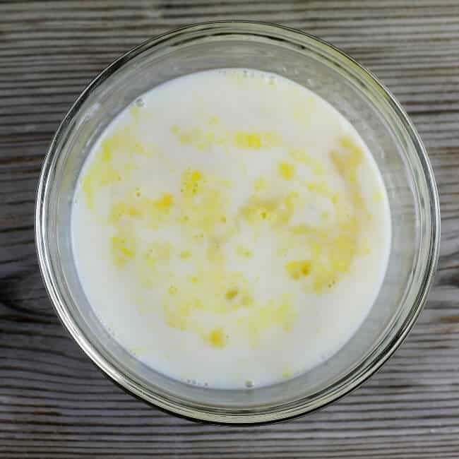 Buttermilk and eggs are added to a small bowl.