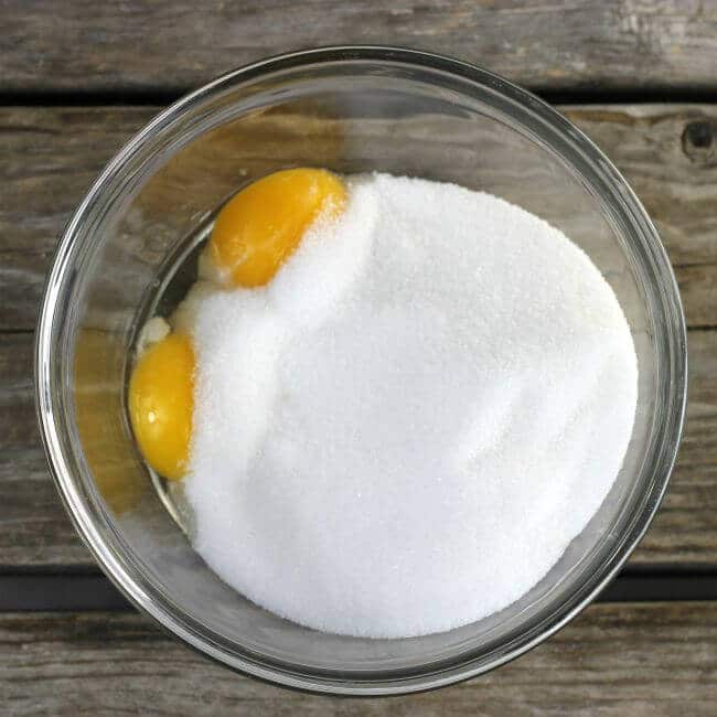 Egg yolks added to the sugar.