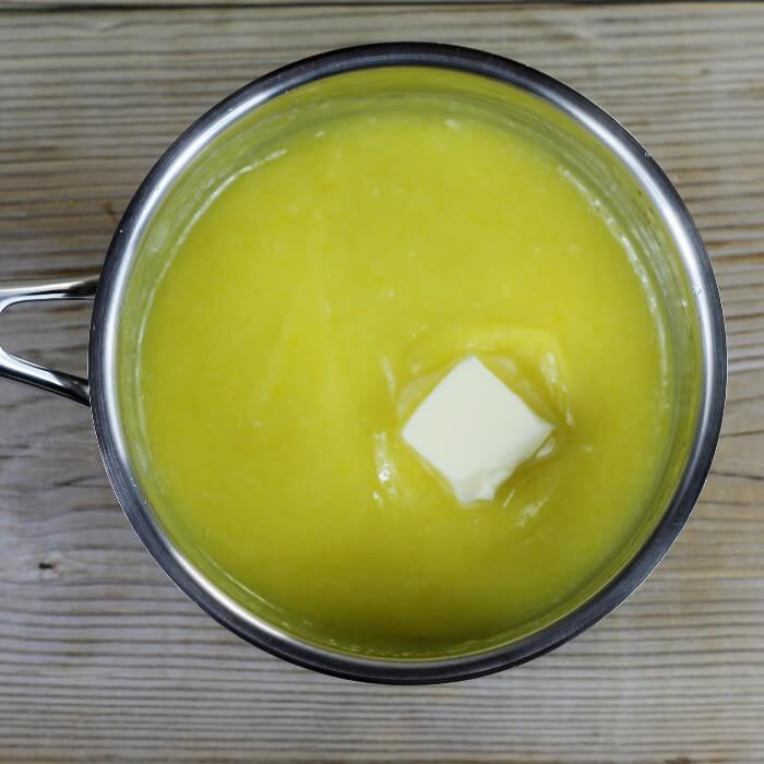 Add the butter to the lemon curd mixture.