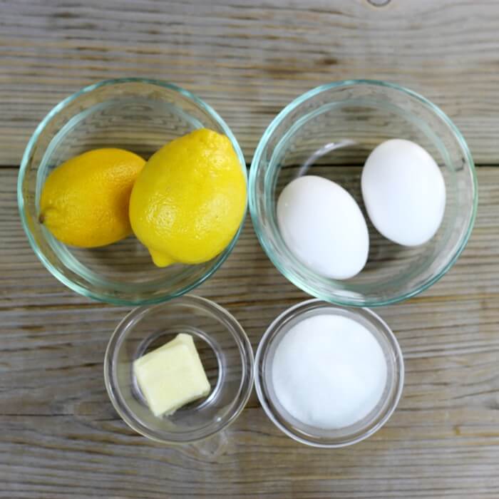 Ingredients for lemon curd in bowls.