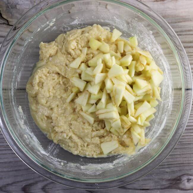 Apples are added to the muffin batter.