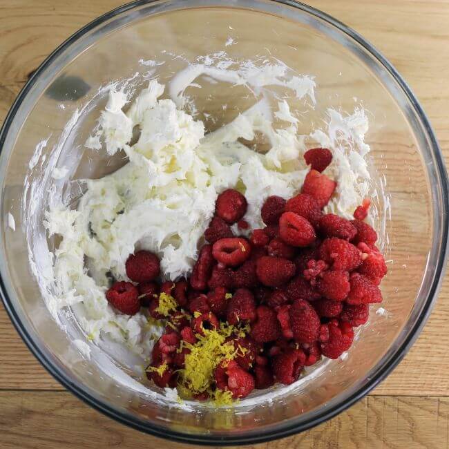 Raspberries and lemon zest are added to the cream cheese.