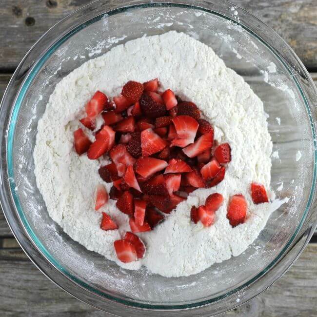 Strawberries are added to the flour mixute.