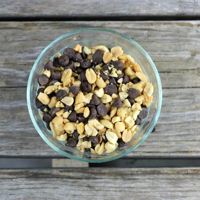 Peanuts and chocolate chips in a bowl.