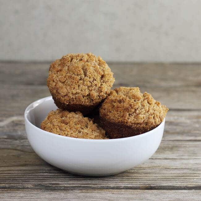 a bowl filled with carrot muffins.