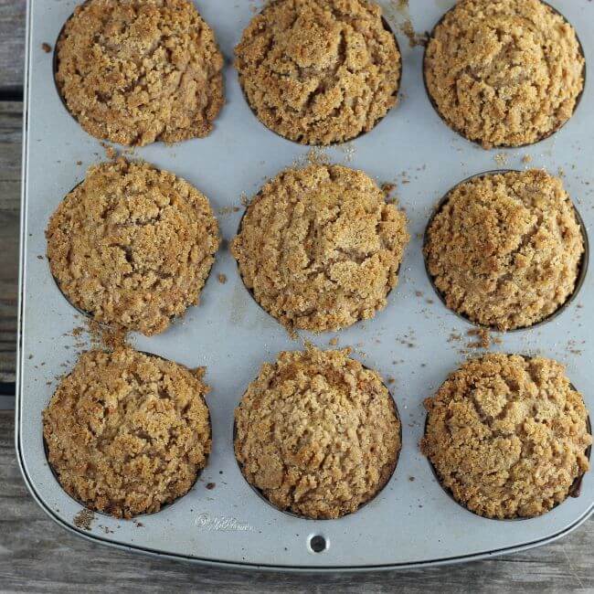 Baked carrot muffins in the muffin tins.