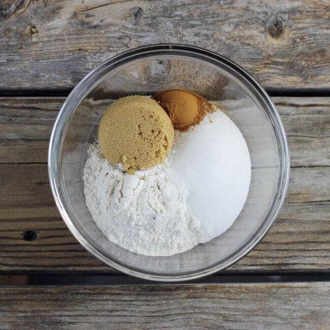 Flour, sugar, and cinnamon in a glass bowl.