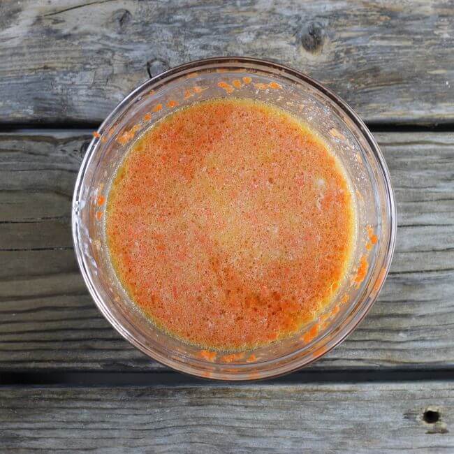 Wet ingredients in a bowl for the carrot muffins.