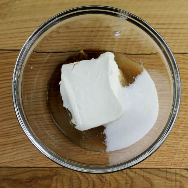 Cream cheese, sugar, and vanilla in a mixing bowl.
