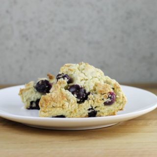 A side view of a couple blueberry banana scones.