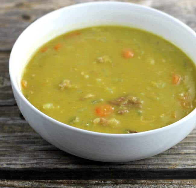 Split pea soup in a white bowl.