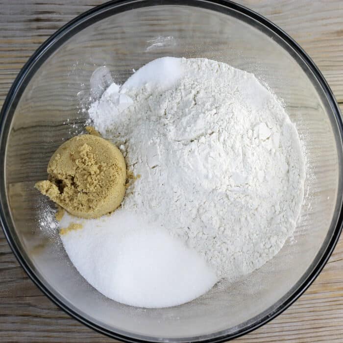 Flour, sugars, baking powder, baking soda, and salt add to a medium bow. 