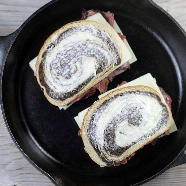 Place the sandwiches into a skillet to grill.