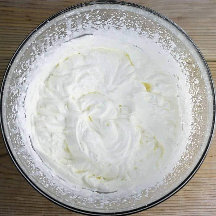 Looking down at whipping cream in a bowl. 