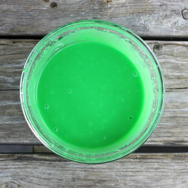 Looking down at a bowl of green pudding.