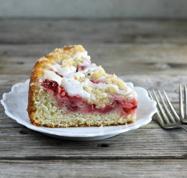 Side view of a slice of strawberry coffee cake.