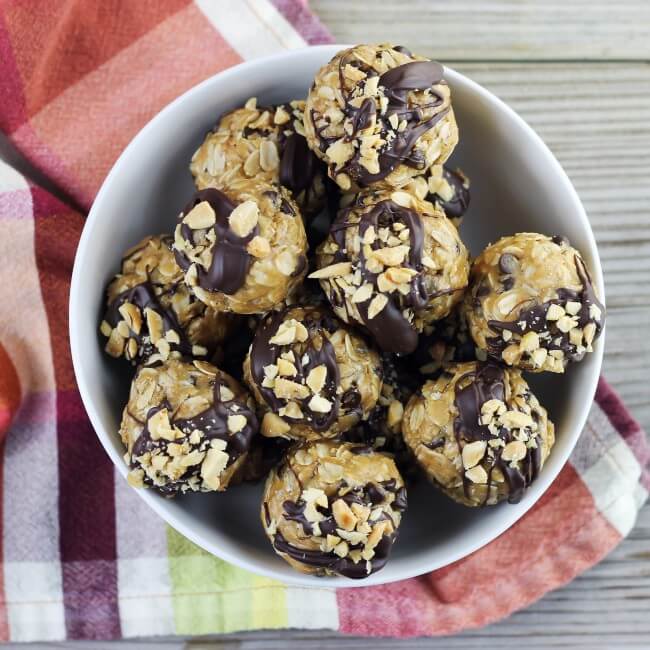 Looking down at a bowl of no bake peanut butter and oatmeal balls.