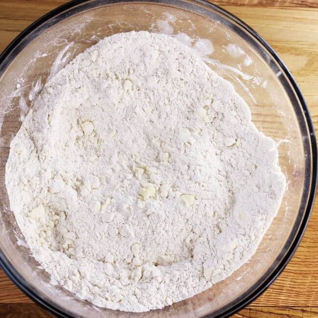 Flour and butter mixture in a glass bowl.