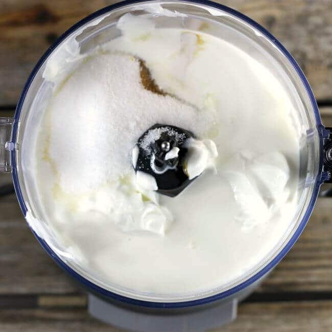 Cream, yogurt, sugar, and vanilla in a food processor.