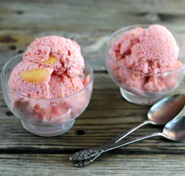Side angle view of peach strawberry frozen yogurt.
