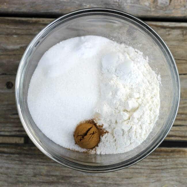 Flour, sugar, and cinnamon in a bowl.