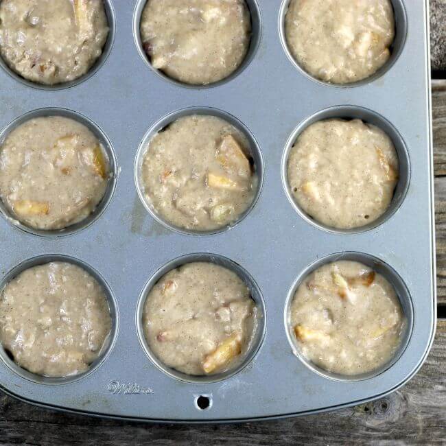 Muffin tins filled with batter.