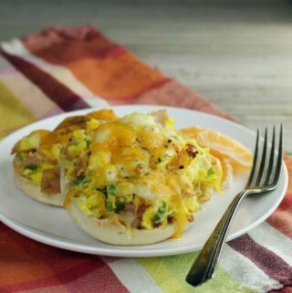 A side angle view of a two English muffin pizzas