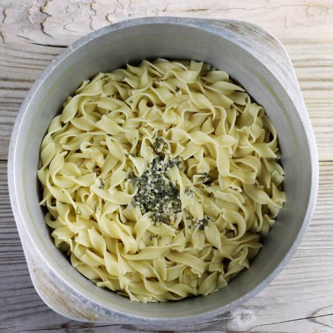 Garlic, parsley, and butter are added to the egg noodles.