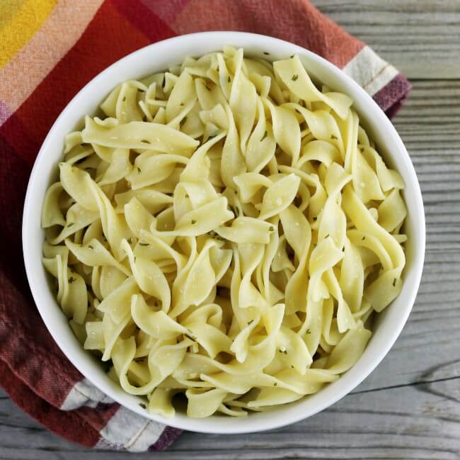 Looking down at a bowl of egg noodles.