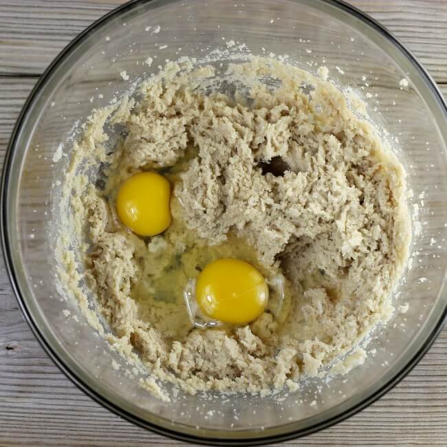 Add the two eggs to the cookie batter.