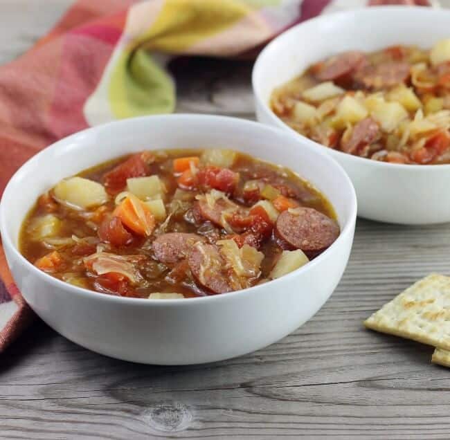 A side angle view of a couple bowls of soup.