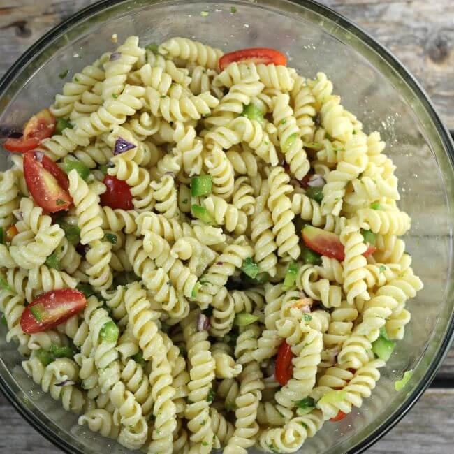 Pasta salad in a glass bowl.