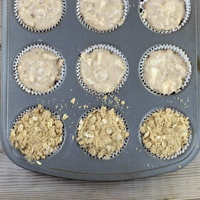 The batter is spooned into the muffin tins and topped with the brown sugar topping.