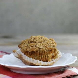 Side view of a muffin with the paper partially taken off.