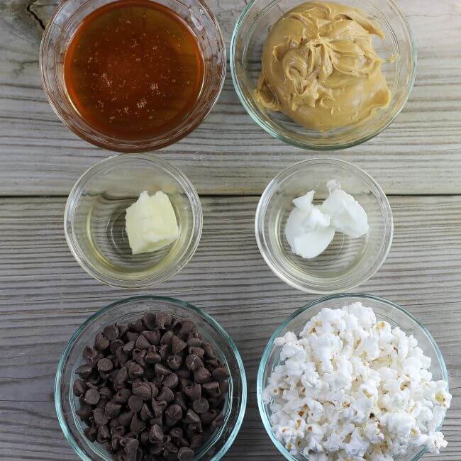 Looking down at ingredients for chocolate peanut butter popcorn.