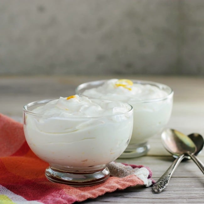 A side view of two bowls of orange mousse.