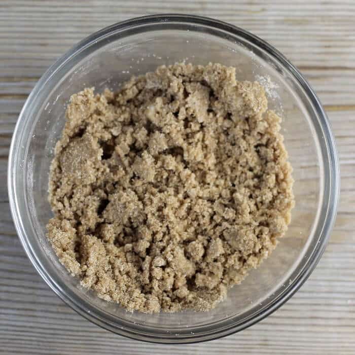 Brown sugar crumble in a small glass bowl.