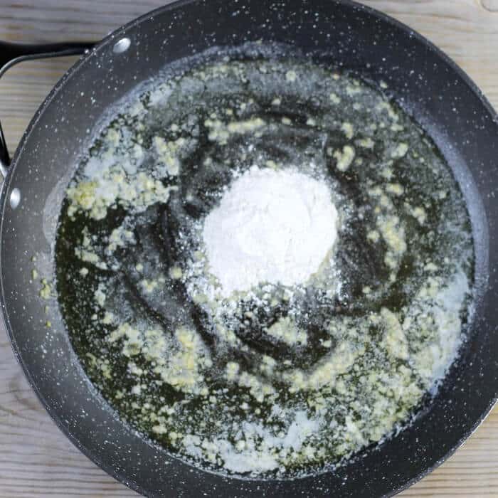 Flour is added to the skillet. 