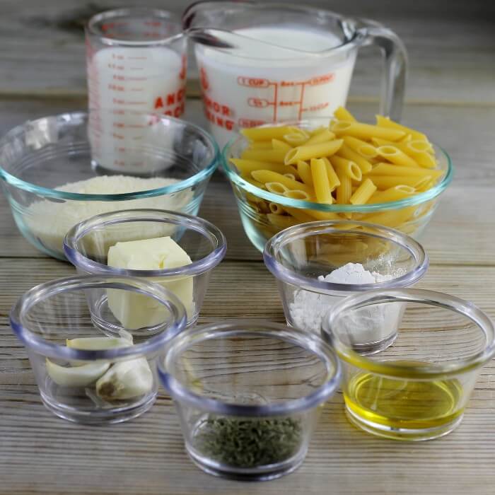 Ingredients for making pasta with a cream sauce.