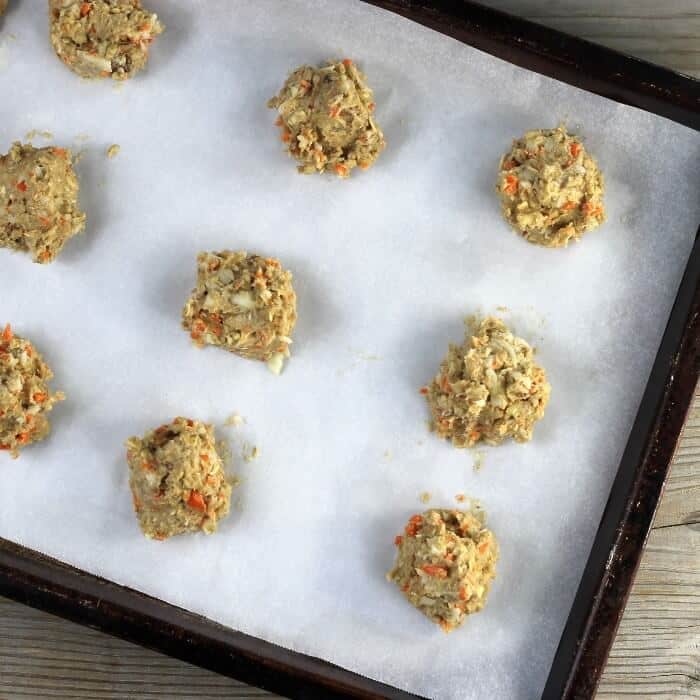 Raw cookies on a baking sheet, ready for the oven.