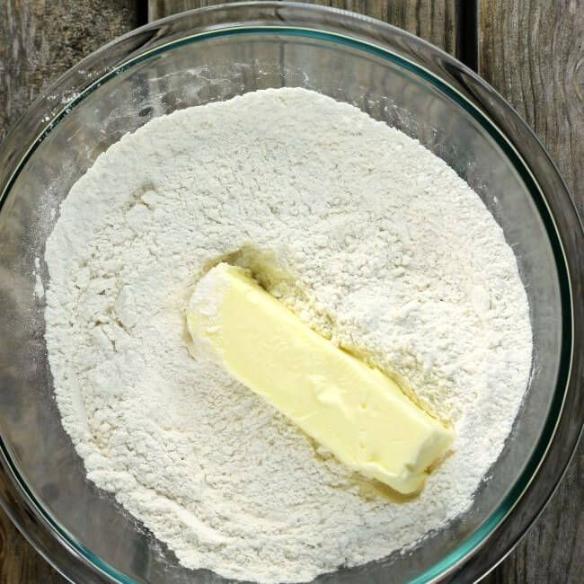Butter on top of a flour mixture.