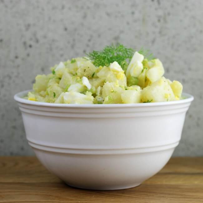 https://www.wordsofdeliciousness.com/wp-content/uploads/2016/08/Side-view-of-potato-salad-in-a-white-bowl.jpg